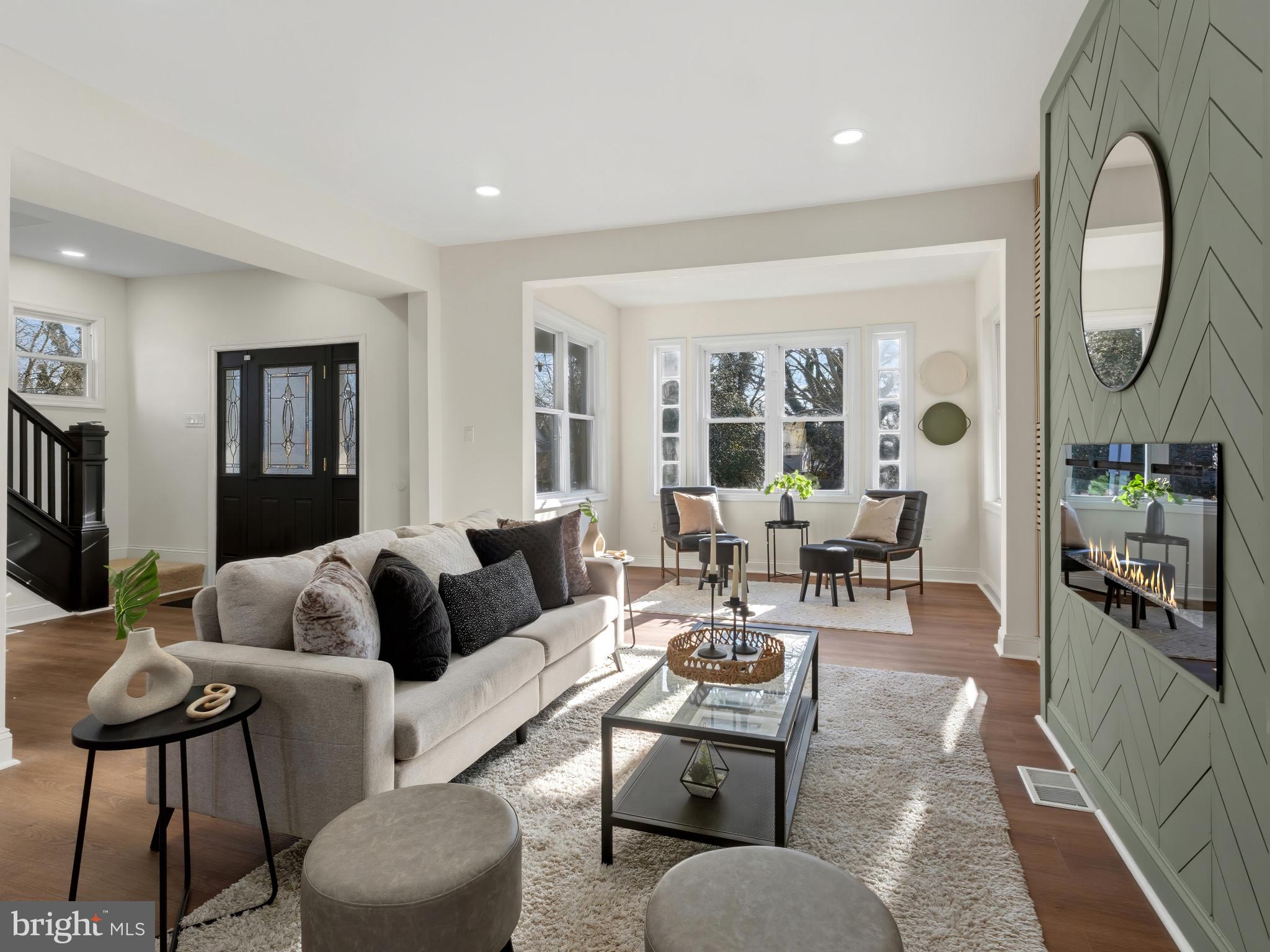 4600 White Avenue Baltimore, MD 21206 - Photo 2 of 40 a living room with furniture a large window and a chandelier
