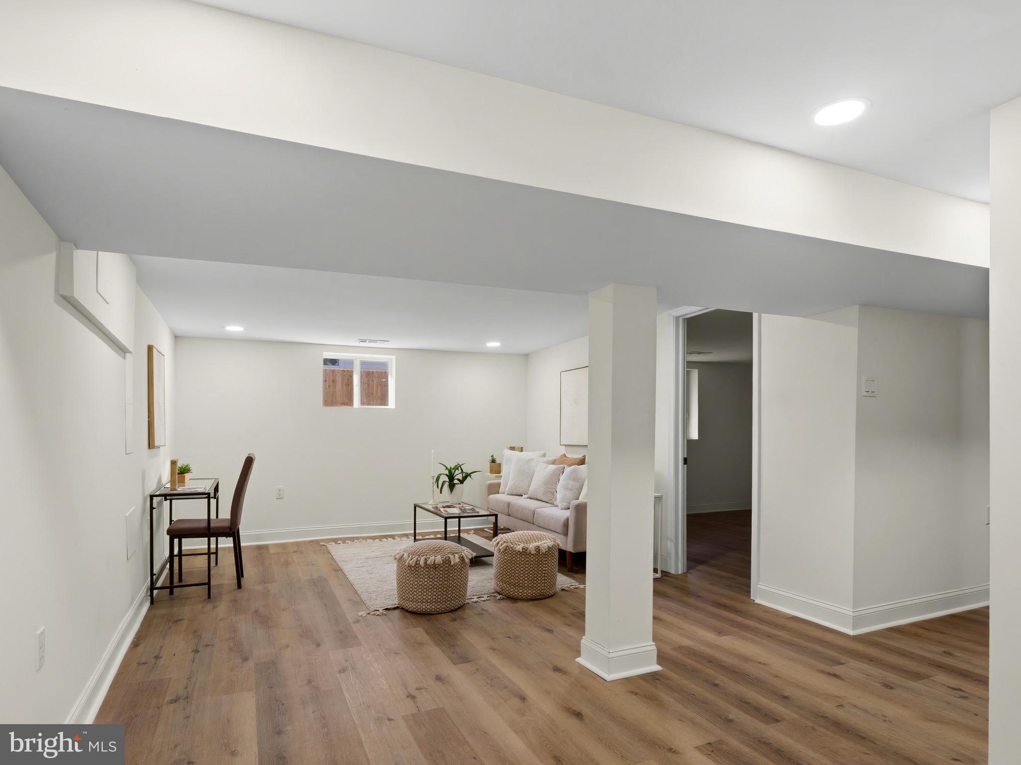 4600 White Avenue Baltimore, MD 21206 - Photo 28 of 40 a living room with furniture and a wooden floor