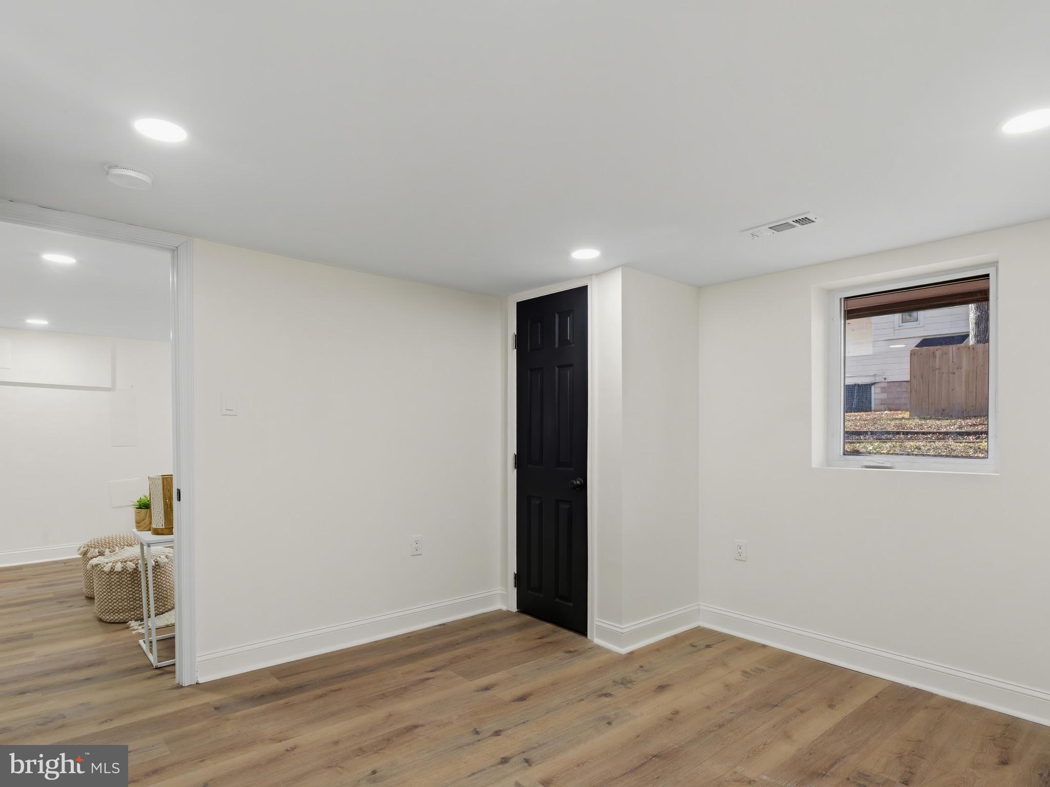 4600 White Avenue Baltimore, MD 21206 - Photo 31 of 40 a view of an empty room with wooden floor and a window