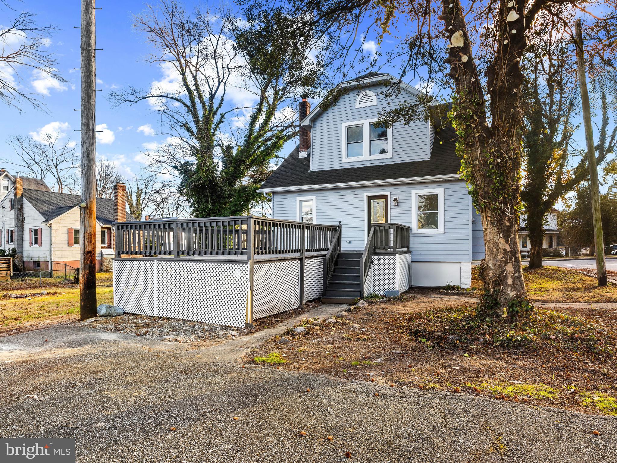4600 White Avenue Baltimore, MD 21206 - Photo 35 of 40 a view of a house with a large tree and a yard