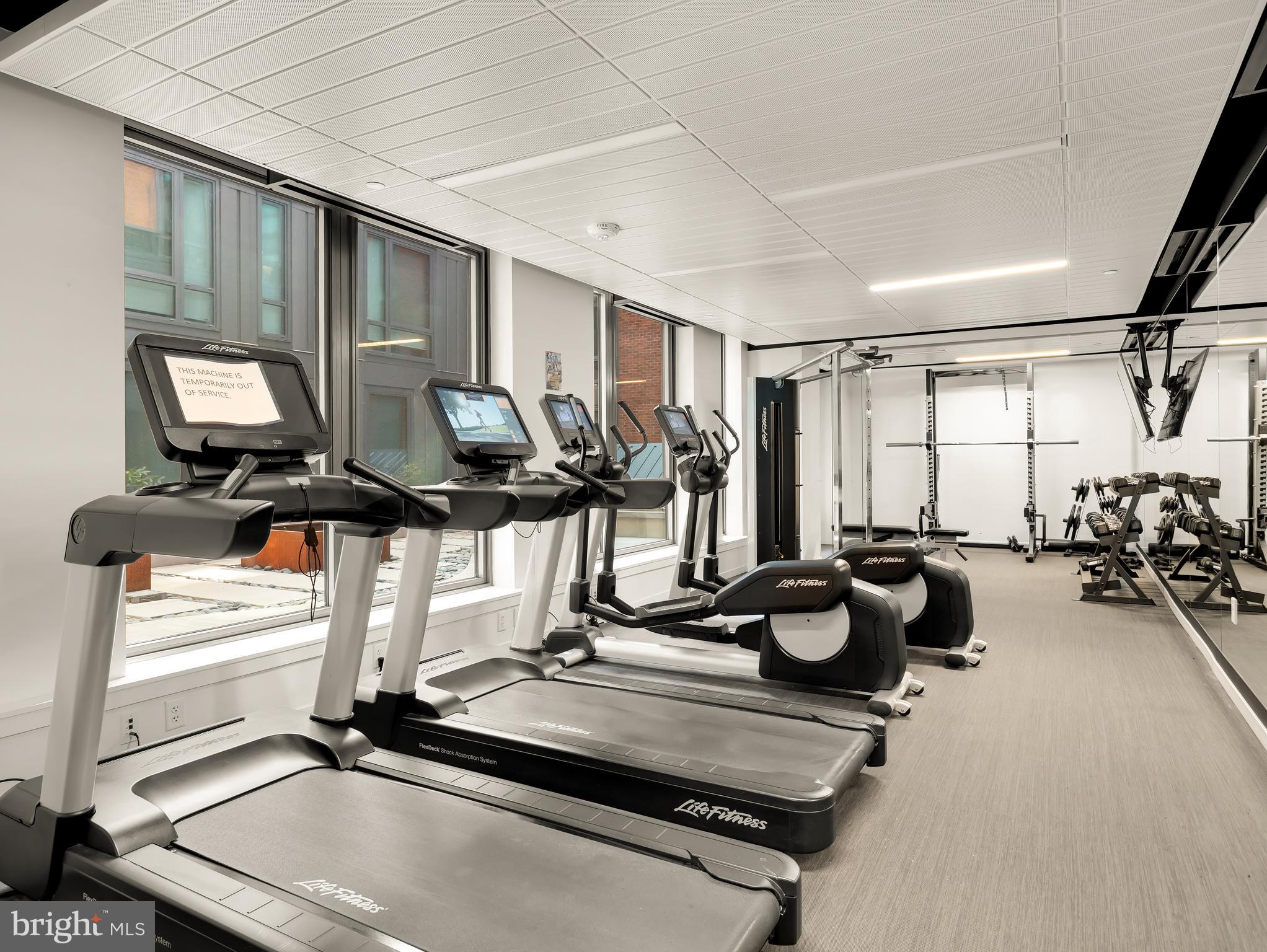 1211 Van Street Southeast, Unit 501 Washington, DC 20003 - Photo 15 of 37 a room with gym equipment and large window