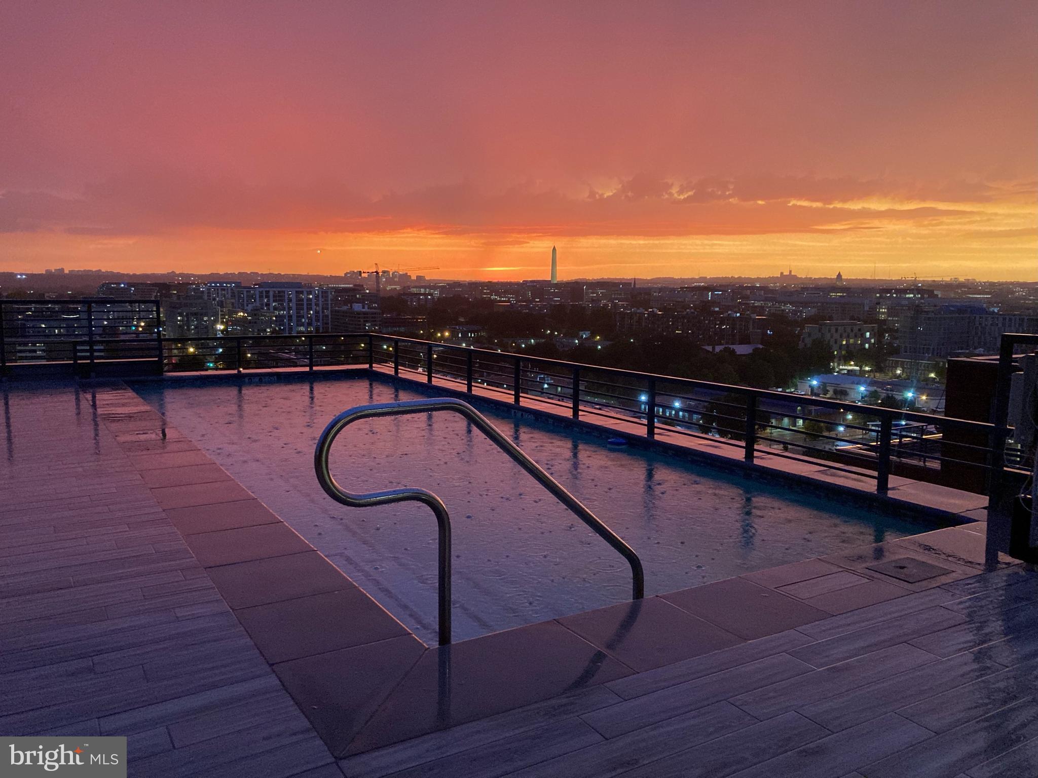 1211 Van Street Southeast, Unit 501 Washington, DC 20003 - Photo 23 of 37 a view of swimming pool with seating space and mountain view