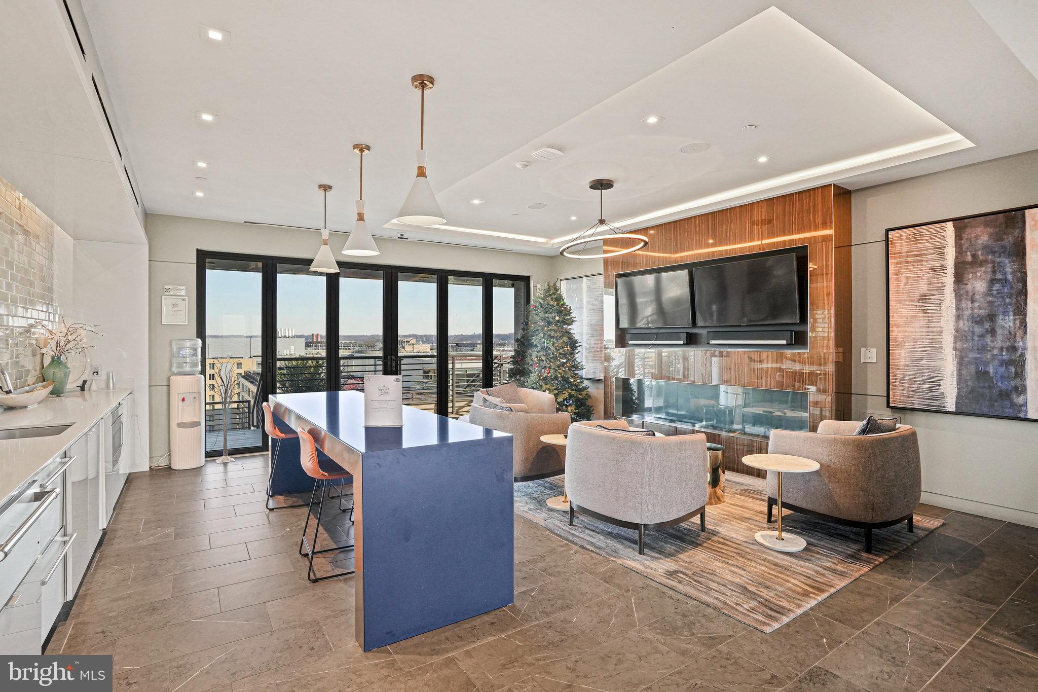 1211 Van Street Southeast, Unit 501 Washington, DC 20003 - Photo 28 of 37 a living room with furniture a large window and a chandelier