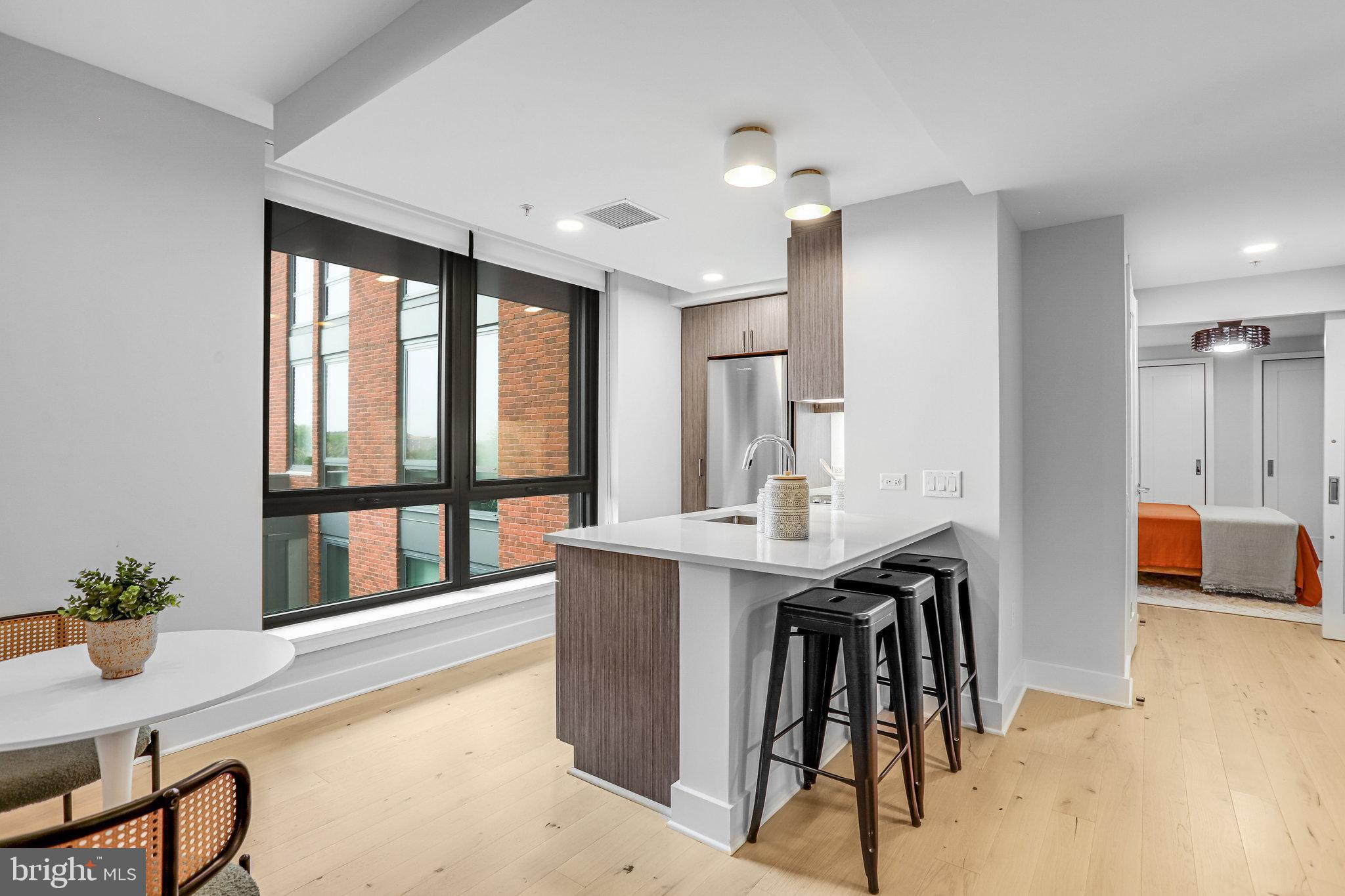1211 Van Street Southeast, Unit 501 Washington, DC 20003 - Photo 3 of 37 a view of kitchen with furniture and large window