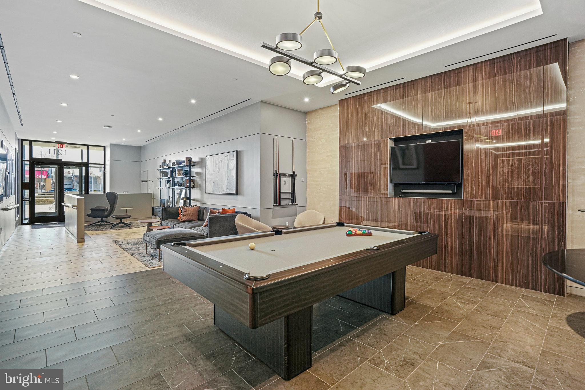 1211 Van Street Southeast, Unit 501 Washington, DC 20003 - Photo 32 of 37 a room with pool table and flat screen tv