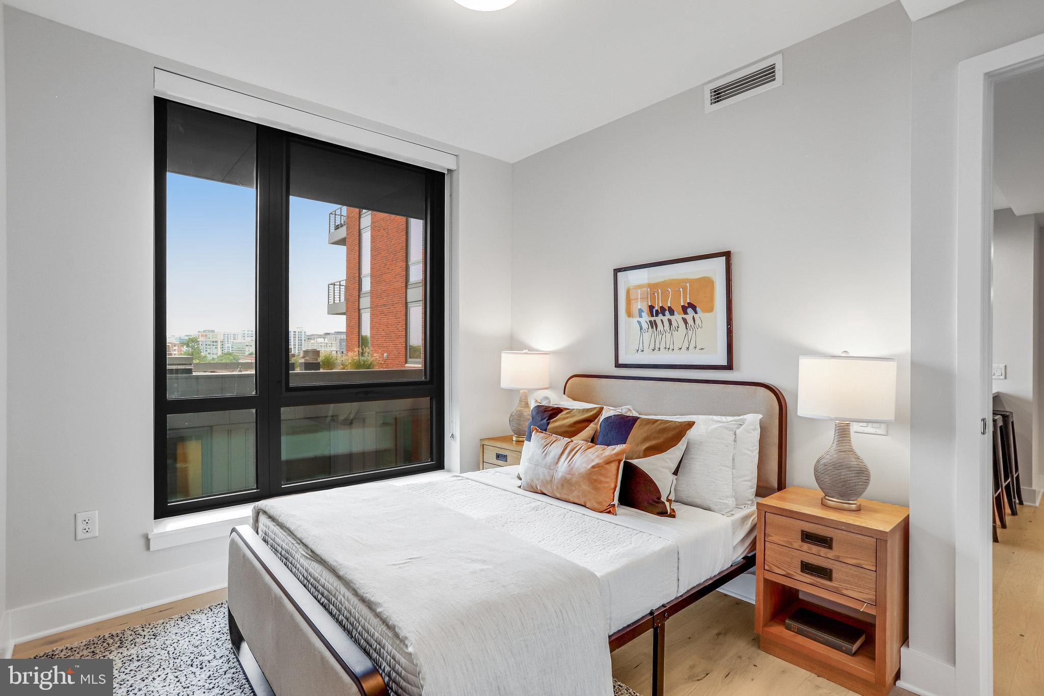 1211 Van Street Southeast, Unit 501 Washington, DC 20003 - Photo 8 of 37 a bedroom with a bed and a window