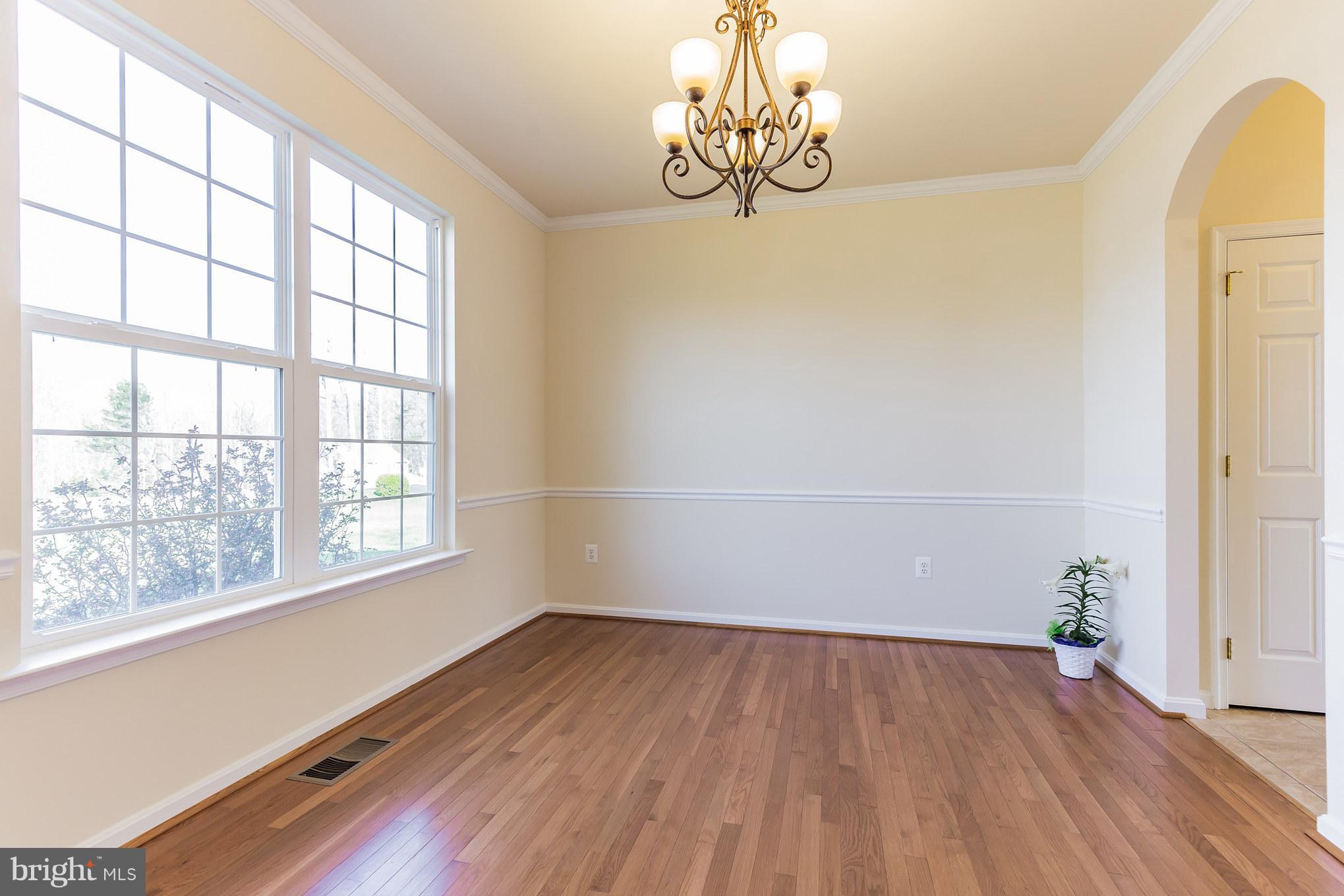 2035 Baythorne Road Prince Frederick, MD 20678 - Photo 14 of 30 wooden floor in an empty room with a window