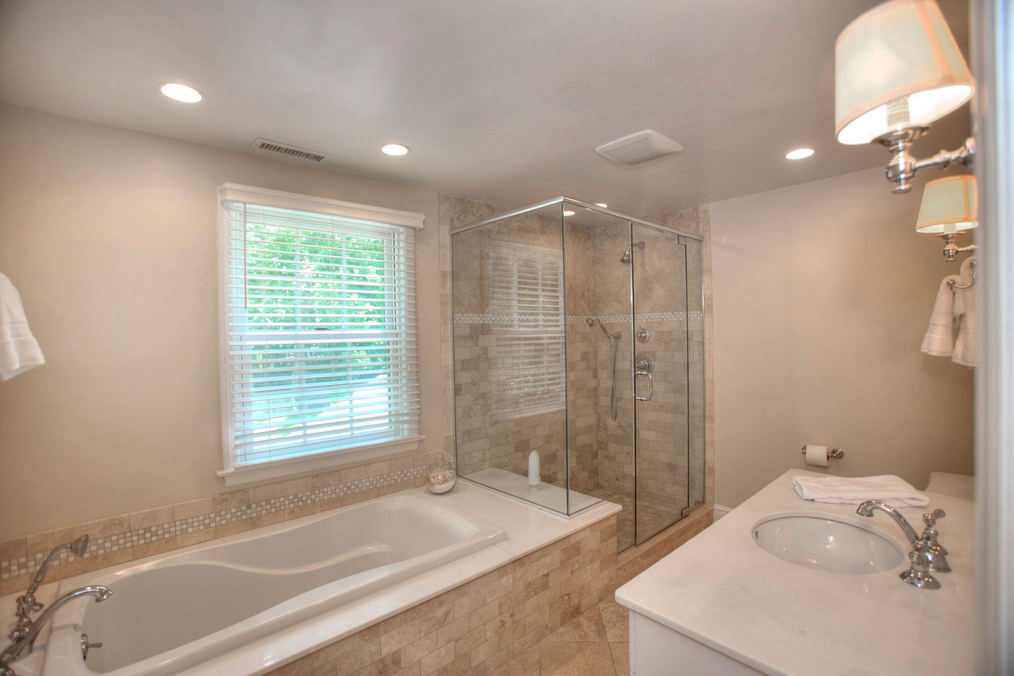 5 Haskell Lane Darien, CT 06820 - Photo 13 of 22 a spacious bathroom with a tub sink and a shower