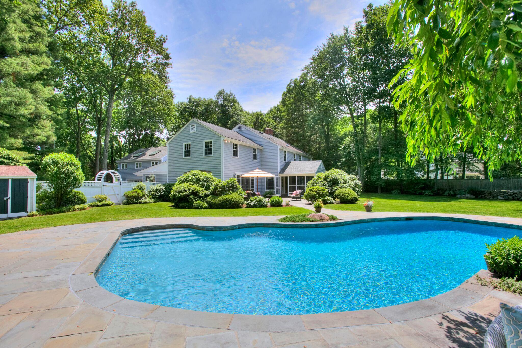 5 Haskell Lane Darien, CT 06820 - Photo 20 of 22 a view of a house with swimming pool and yard