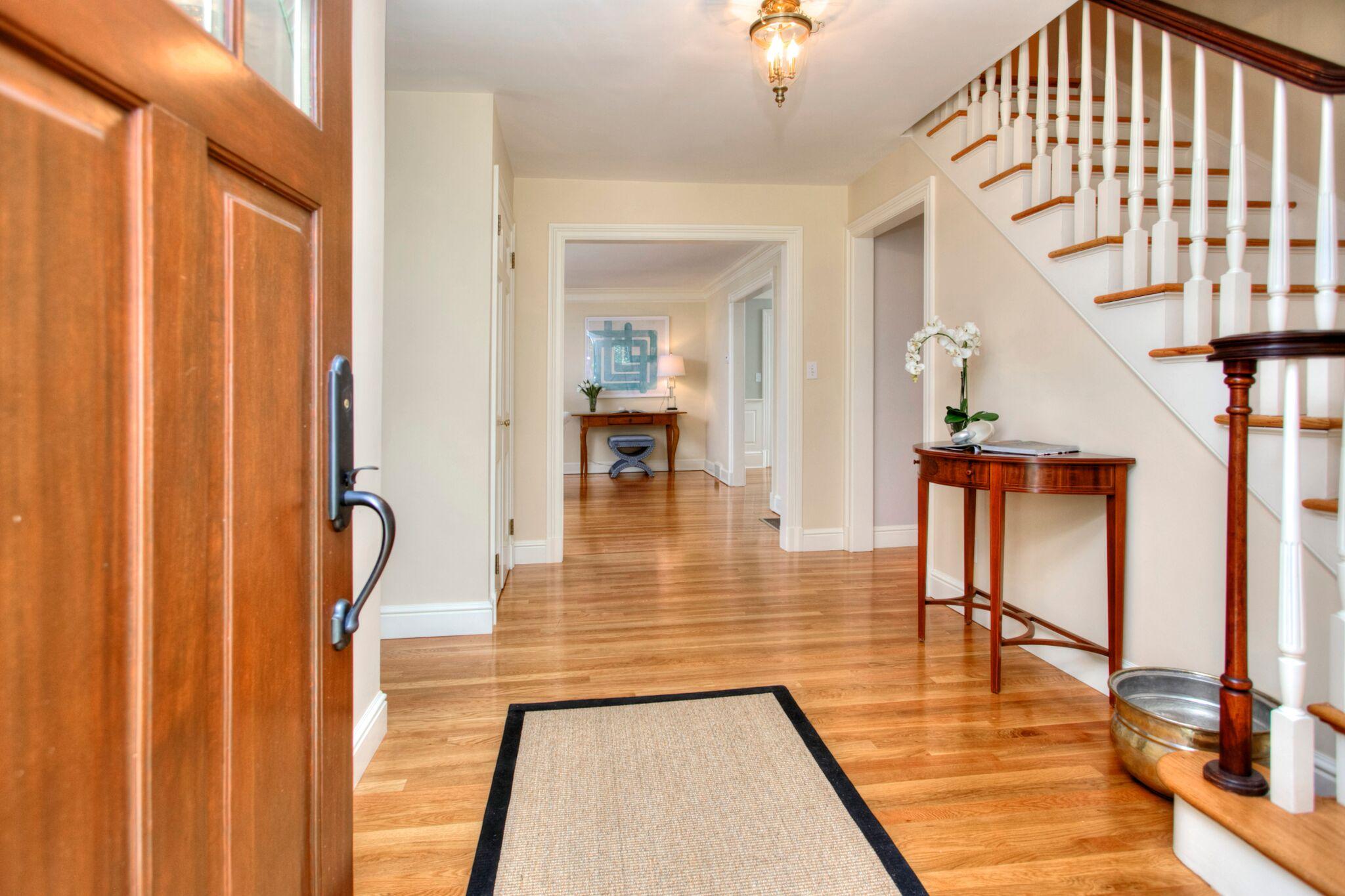 5 Haskell Lane Darien, CT 06820 - Photo 2 of 22 a view of a living room and dining room with a floor to ceiling window