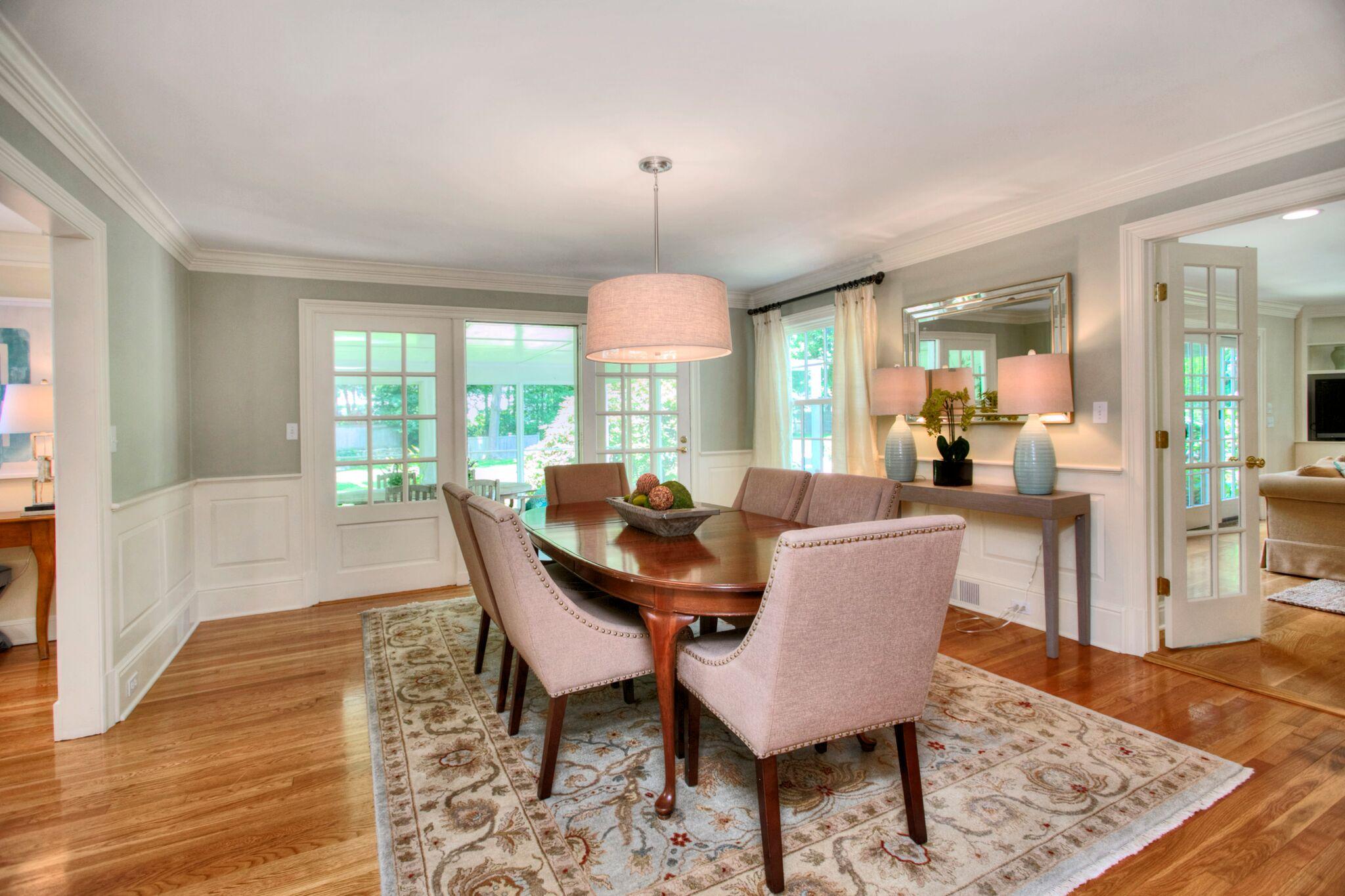 5 Haskell Lane Darien, CT 06820 - Photo 5 of 22 a dining room with furniture a chandelier and wooden floor