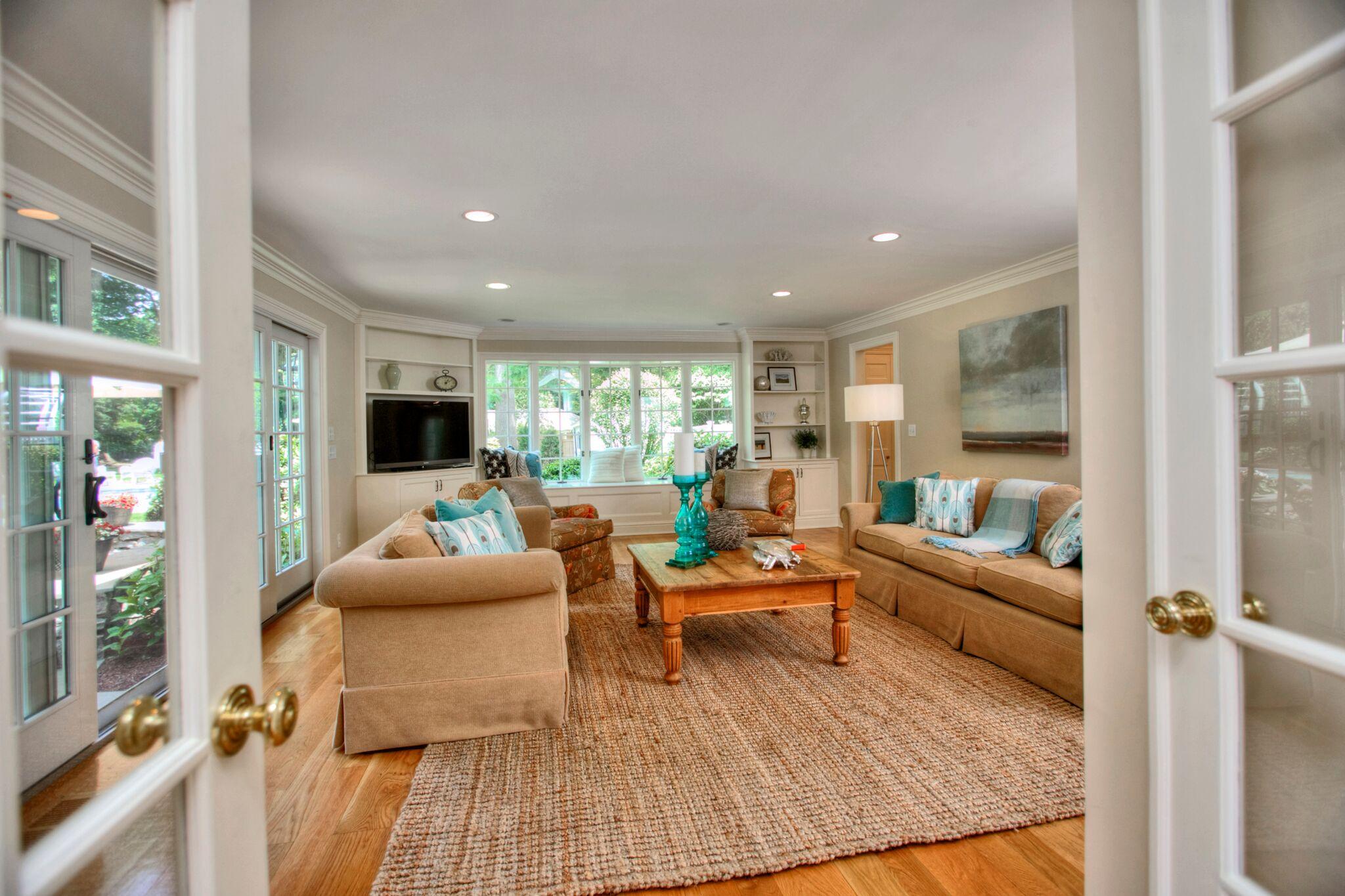 5 Haskell Lane Darien, CT 06820 - Photo 6 of 22 a living room with furniture and a large window