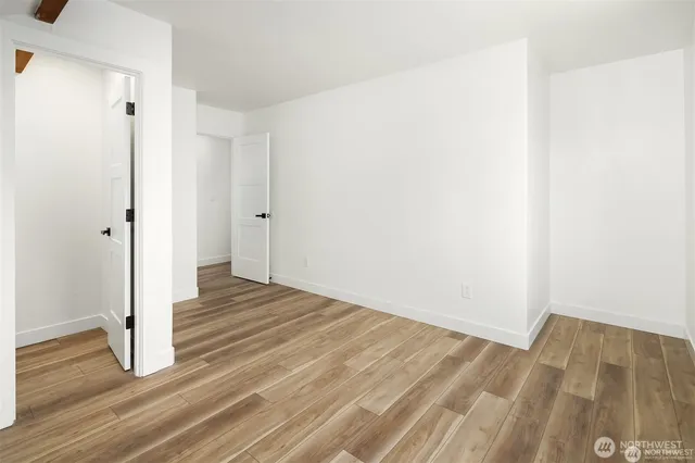 a view of wooden floor in an empty room