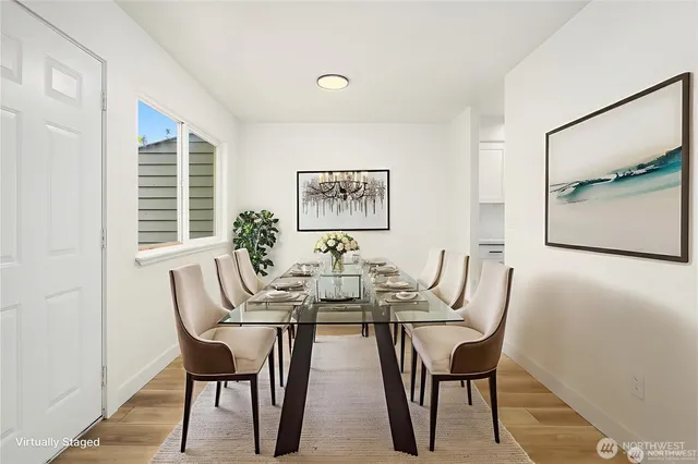 a view of a dining room with furniture and window