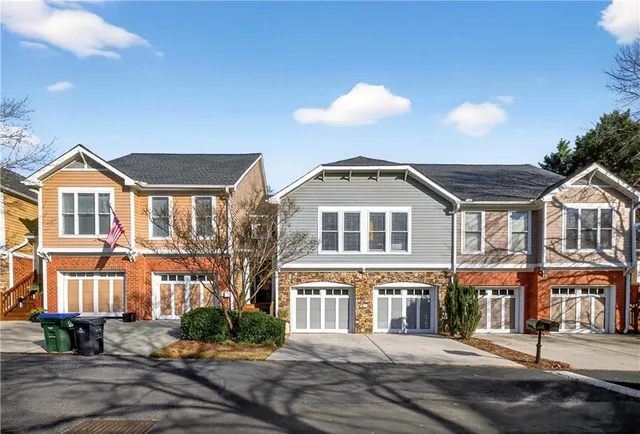 a front view of residential houses with street