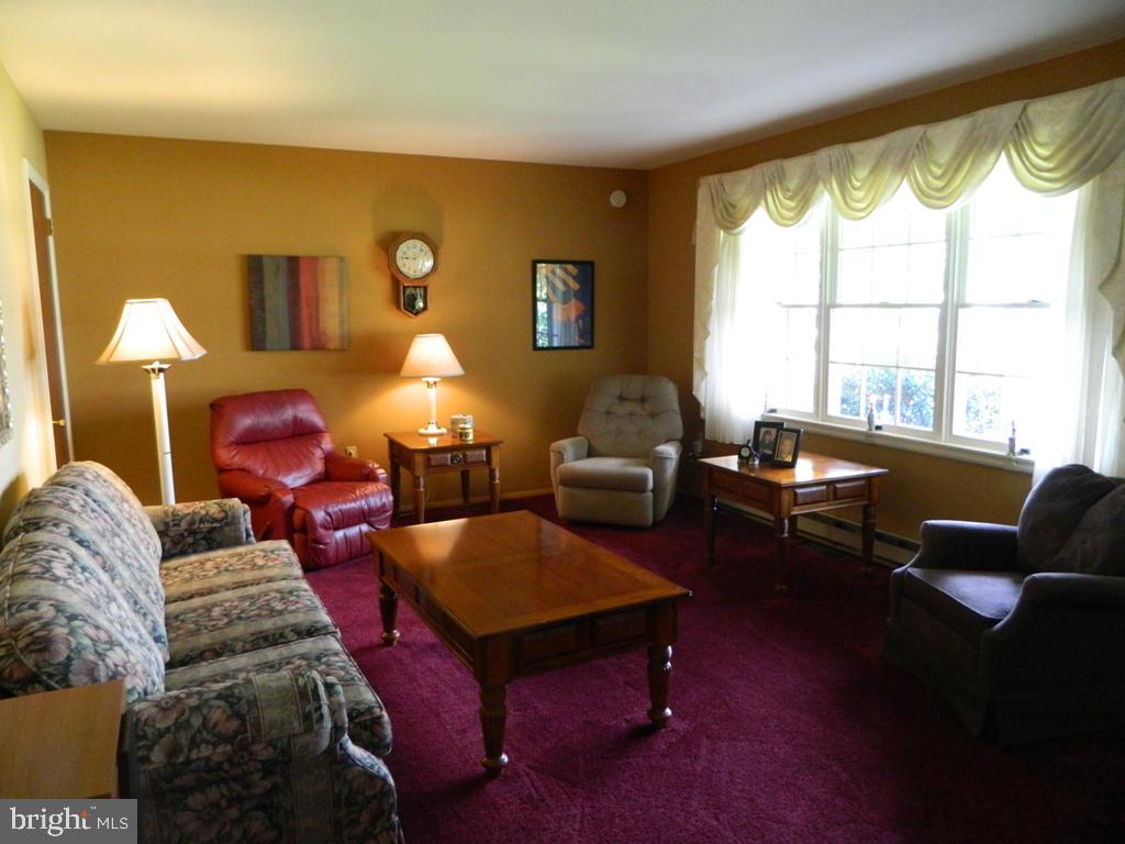 5 Hilltop Road Lititz, PA 17543 - Photo 3 of 12 a living room with furniture fireplace and a large window