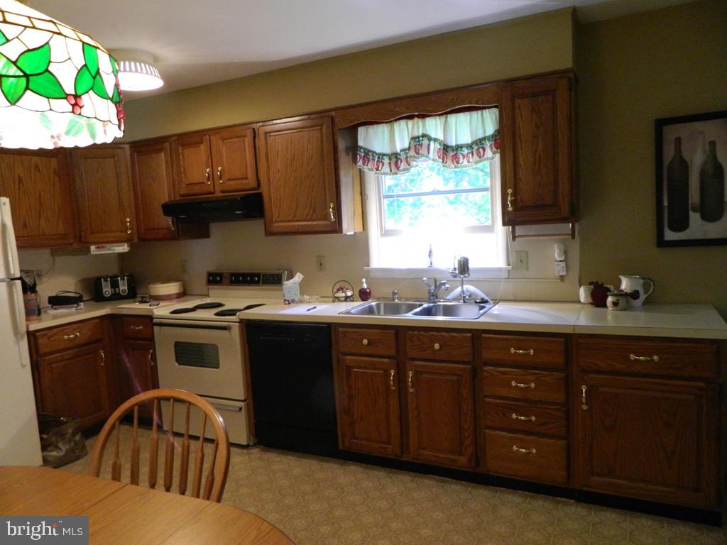 5 Hilltop Road Lititz, PA 17543 - Photo 6 of 12 a kitchen with a sink stove and microwave