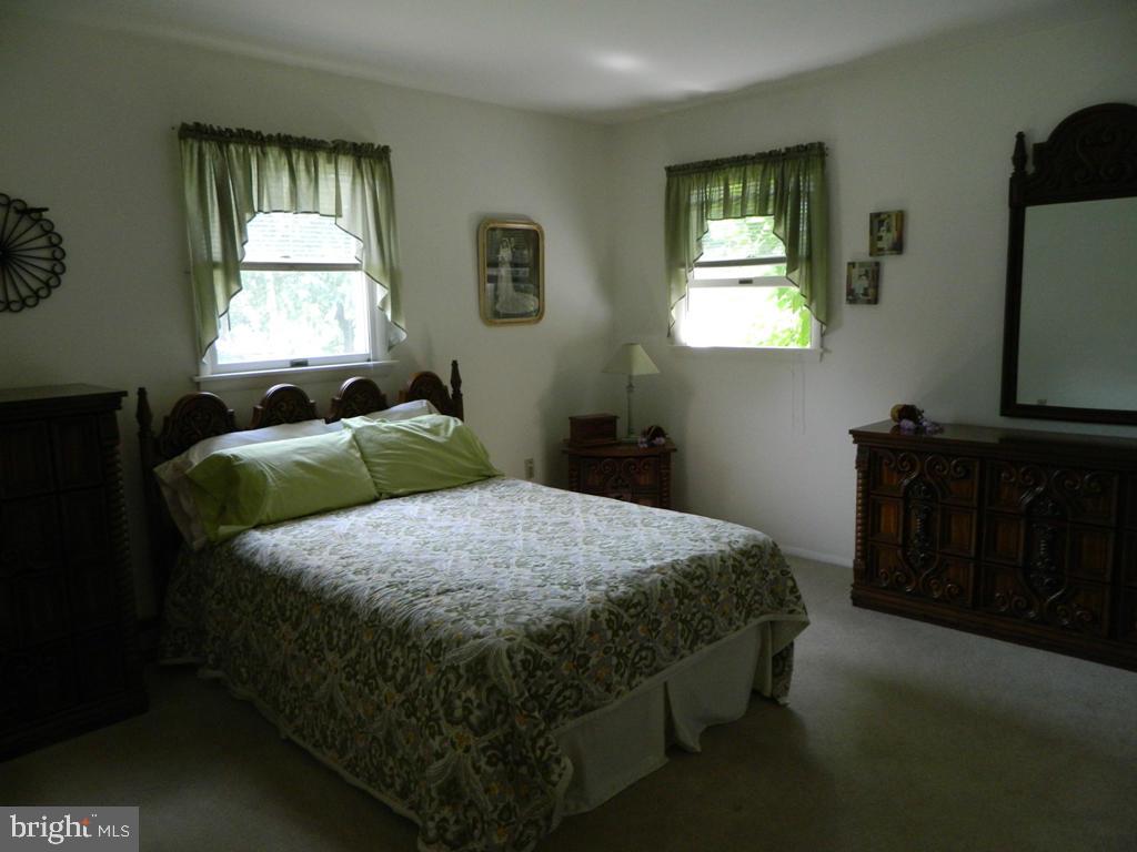 5 Hilltop Road Lititz, PA 17543 - Photo 7 of 12 a bedroom with a bed and a window
