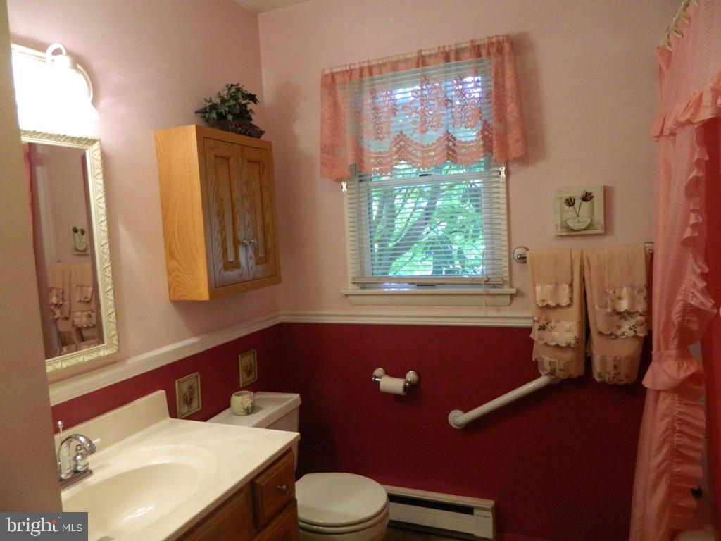 5 Hilltop Road Lititz, PA 17543 - Photo 9 of 12 a bathroom with a sink a toilet and a mirror