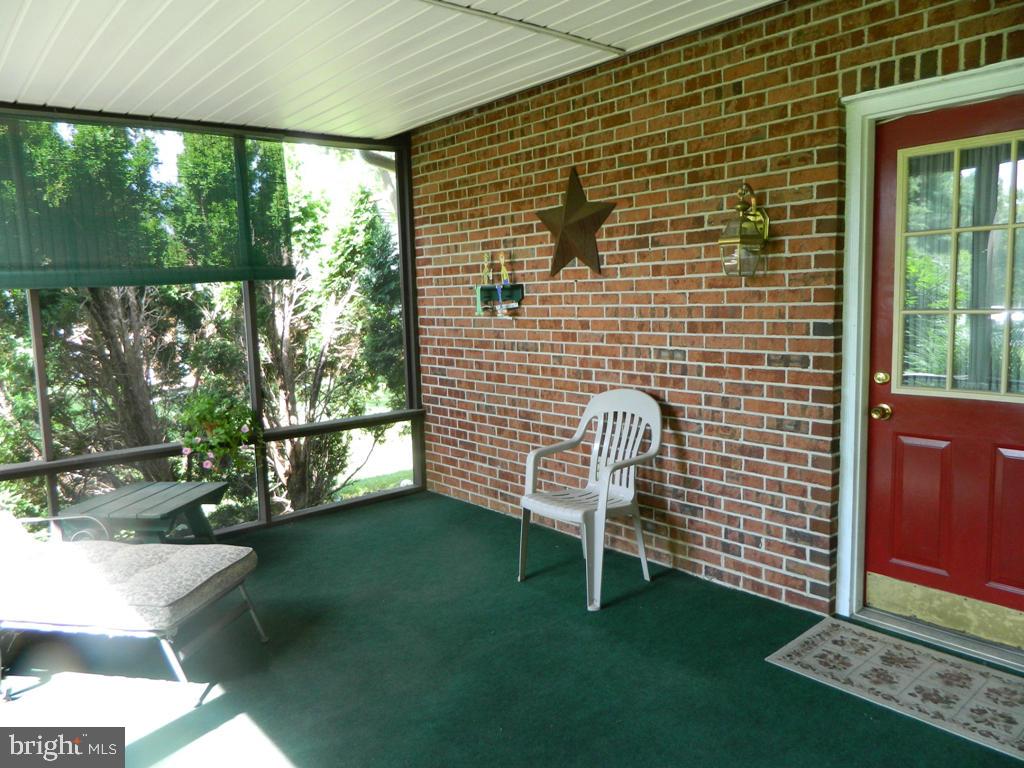 5 Hilltop Road Lititz, PA 17543 - Photo 10 of 12 a view of a chairs and table in patio with a yard
