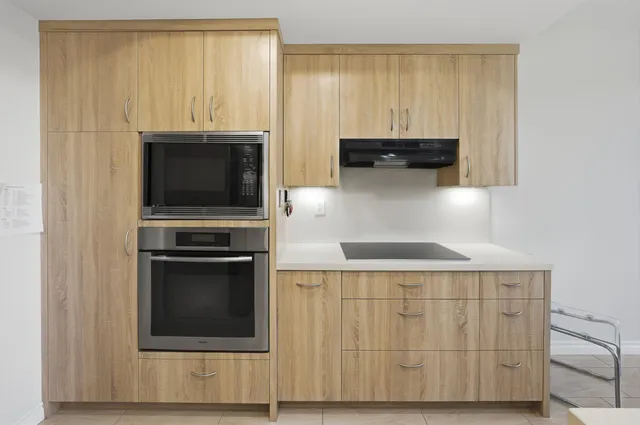 a close view of sink and a refrigerator