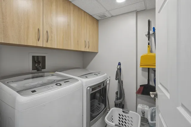 a view of a house with swimming pool and sitting area