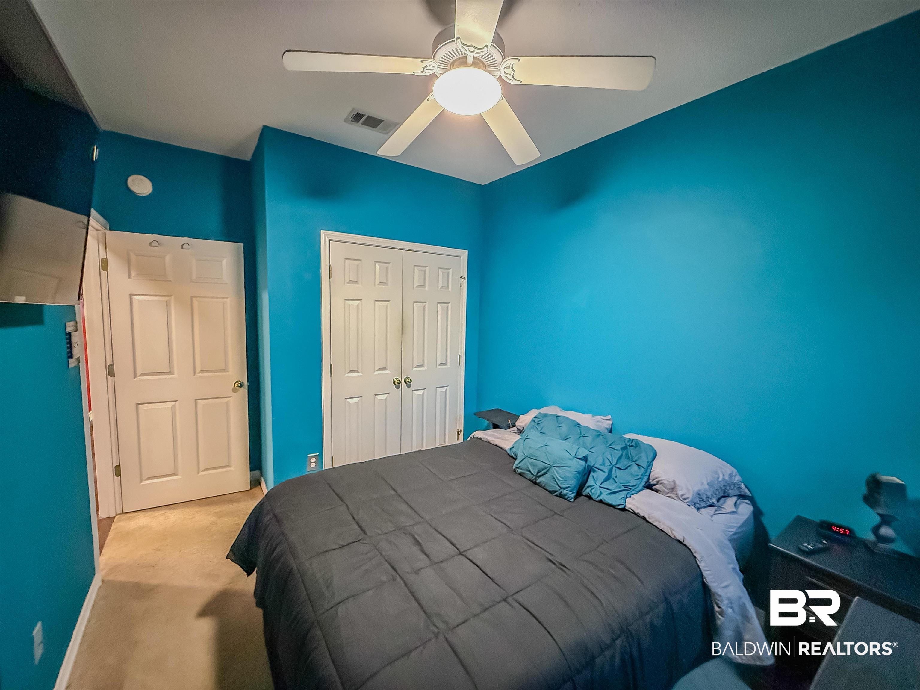 2651 South Juniper Street Foley, AL 36535 - Photo 11 of 20 Bedroom with carpet flooring, ceiling fan, and a closet