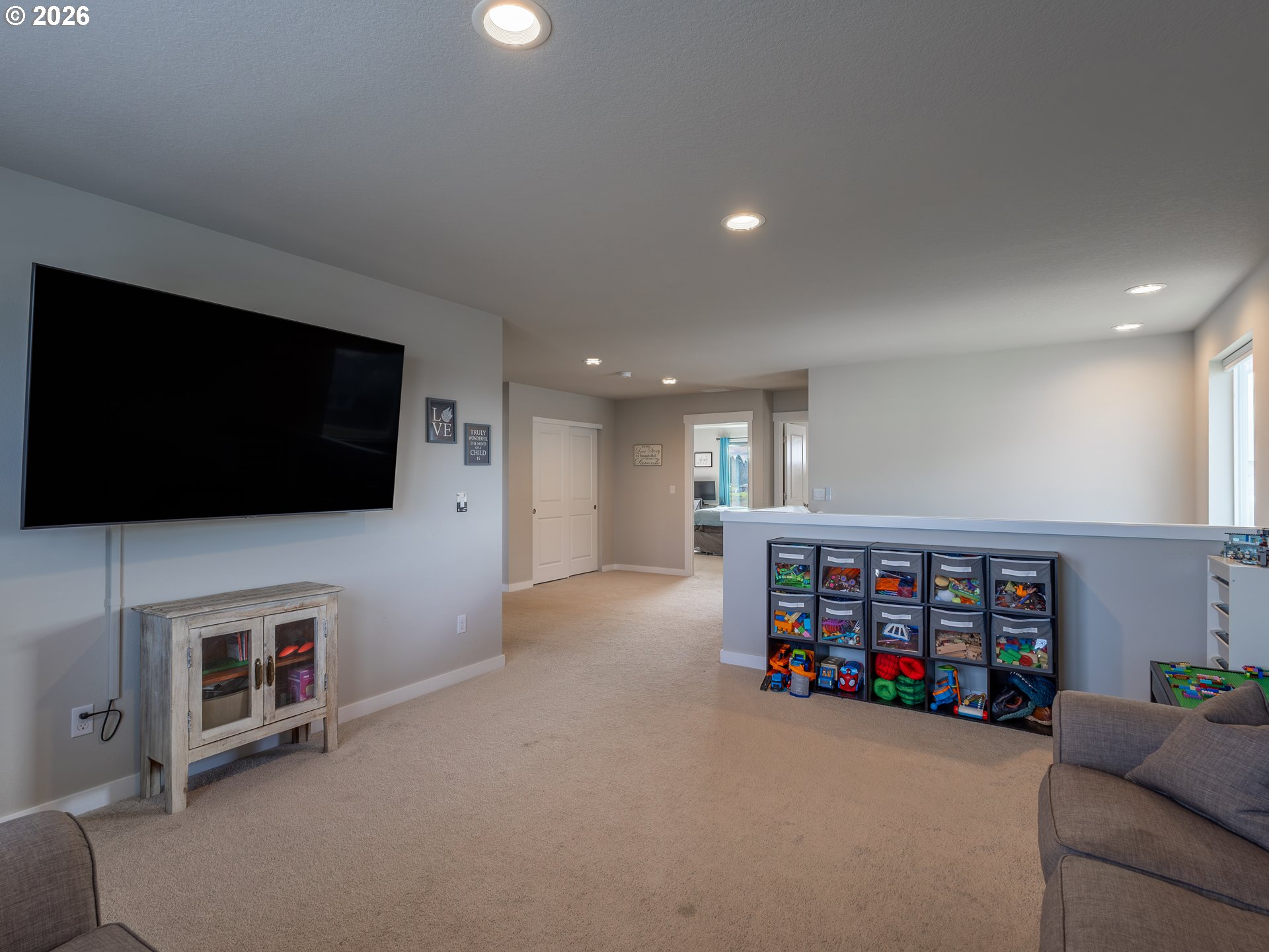 8827 North 1st Circle Ridgefield, WA 98642 - Photo 16 of 38 a living room with furniture and a flat screen tv