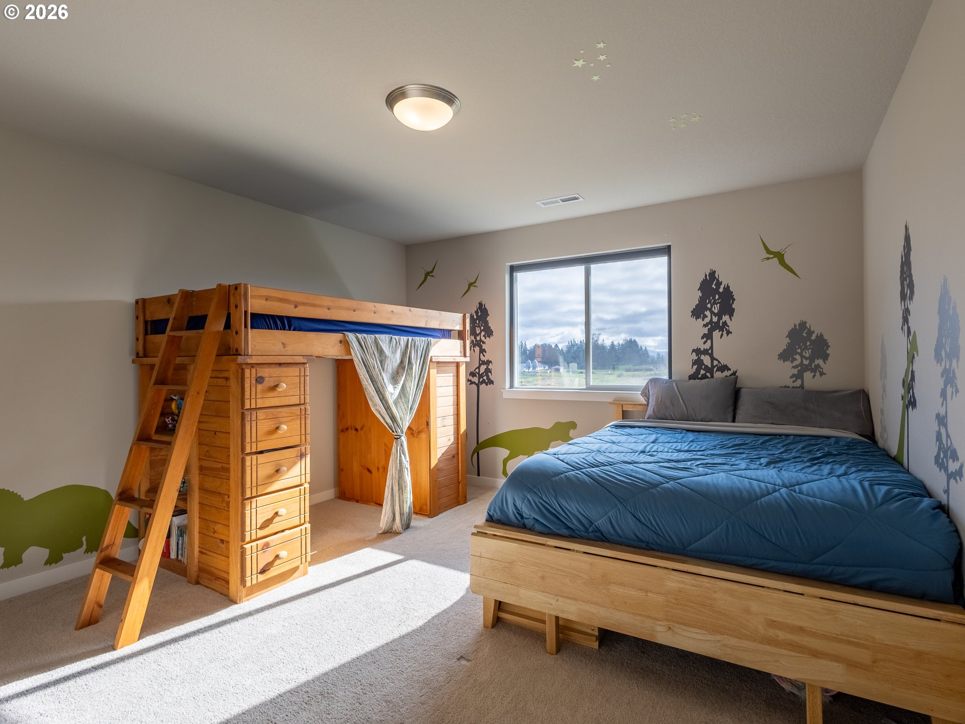 8827 North 1st Circle Ridgefield, WA 98642 - Photo 24 of 38 a bedroom with a bed and a window