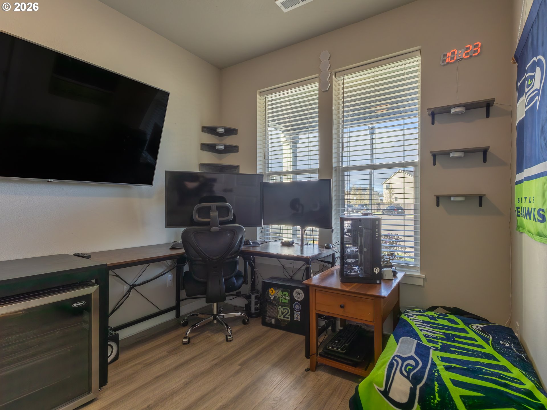 8827 North 1st Circle Ridgefield, WA 98642 - Photo 3 of 38 a view of a workspace with furniture and a window