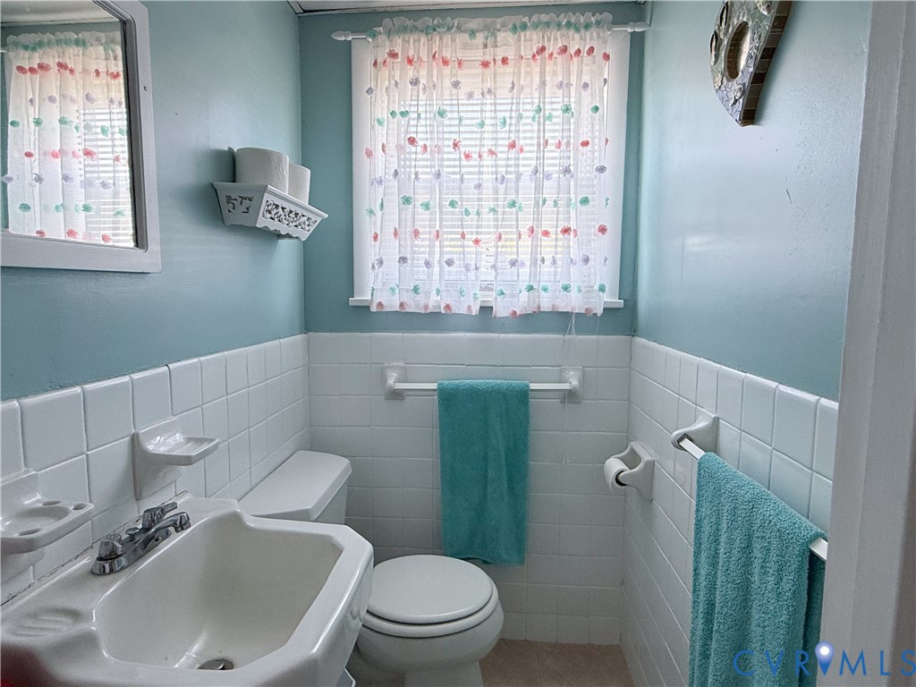 1280 Little Florida Road Farnham, VA 22460 - Photo 20 of 41 Bathroom featuring ceramic tile wainscoting, a wal