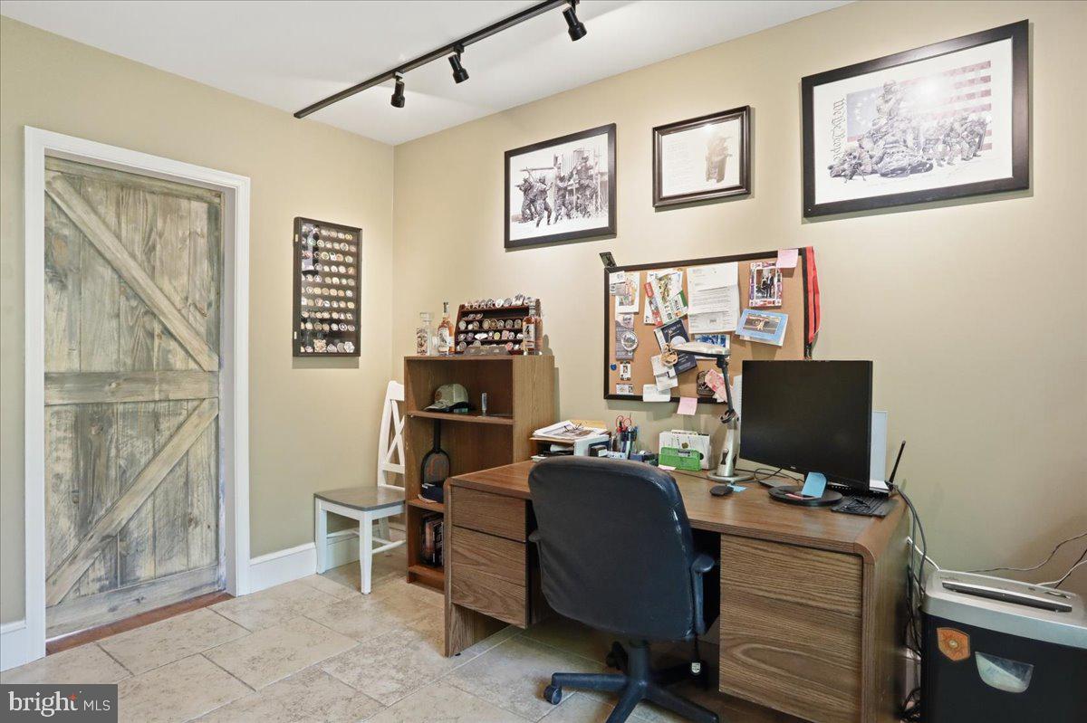 19897 Foresthill Road Bluemont, VA 20135 - Photo 19 of 39 a view of a workspace with furniture and a window