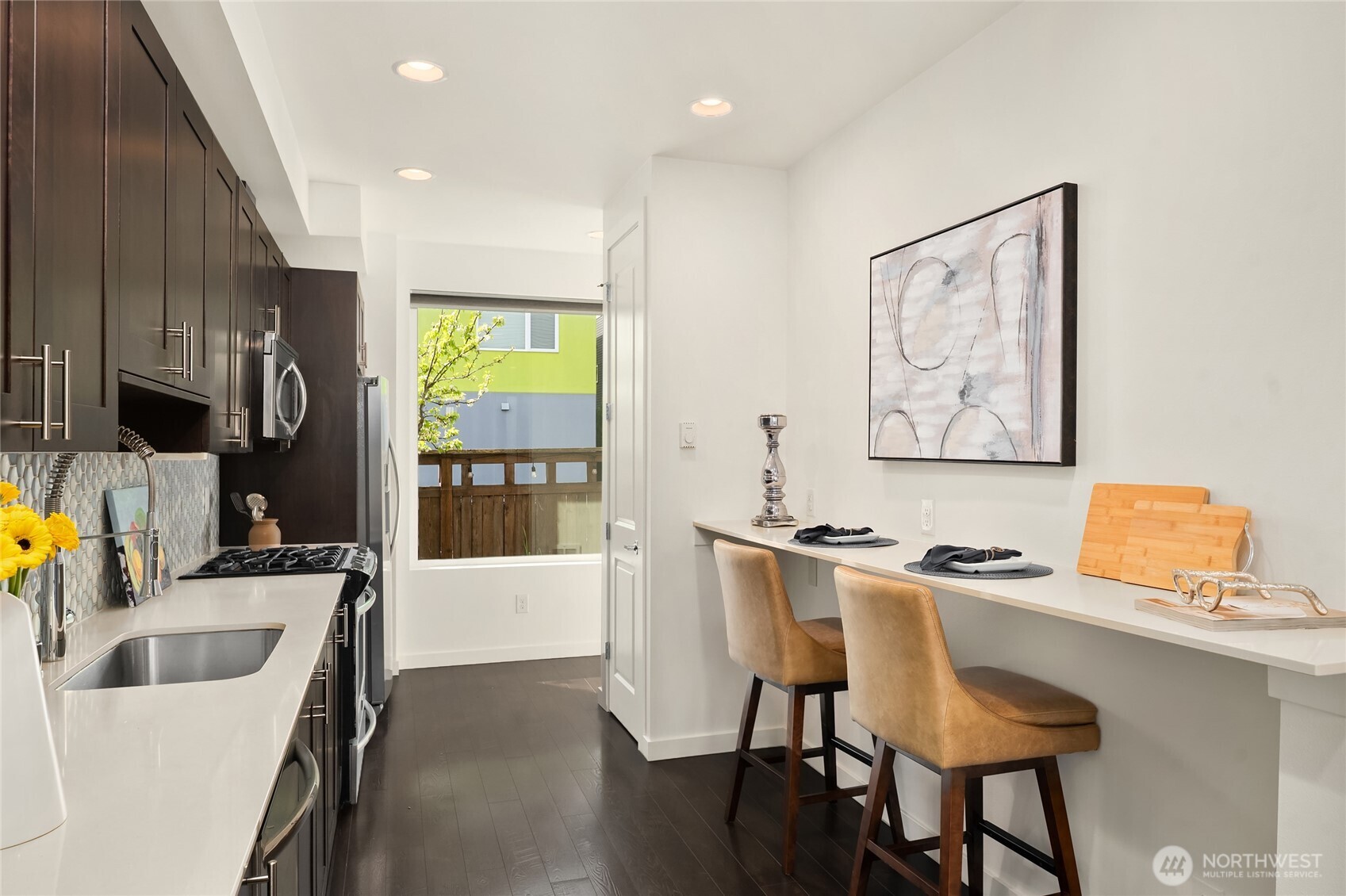 3631 Courtland Place South, Unit B Seattle, WA 98144 - Photo 11 of 27 a kitchen with a sink cabinets and wooden floor