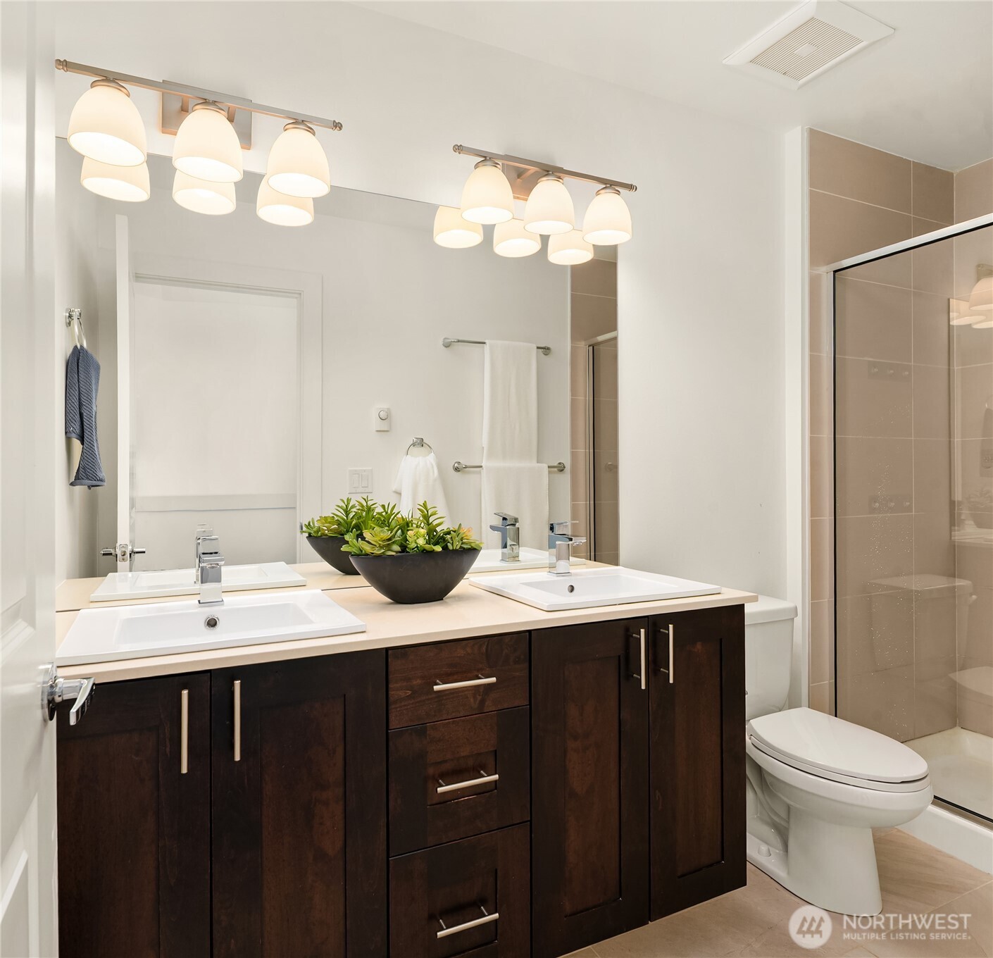 3631 Courtland Place South, Unit B Seattle, WA 98144 - Photo 23 of 27 a bathroom with a double vanity sink mirror and toilet