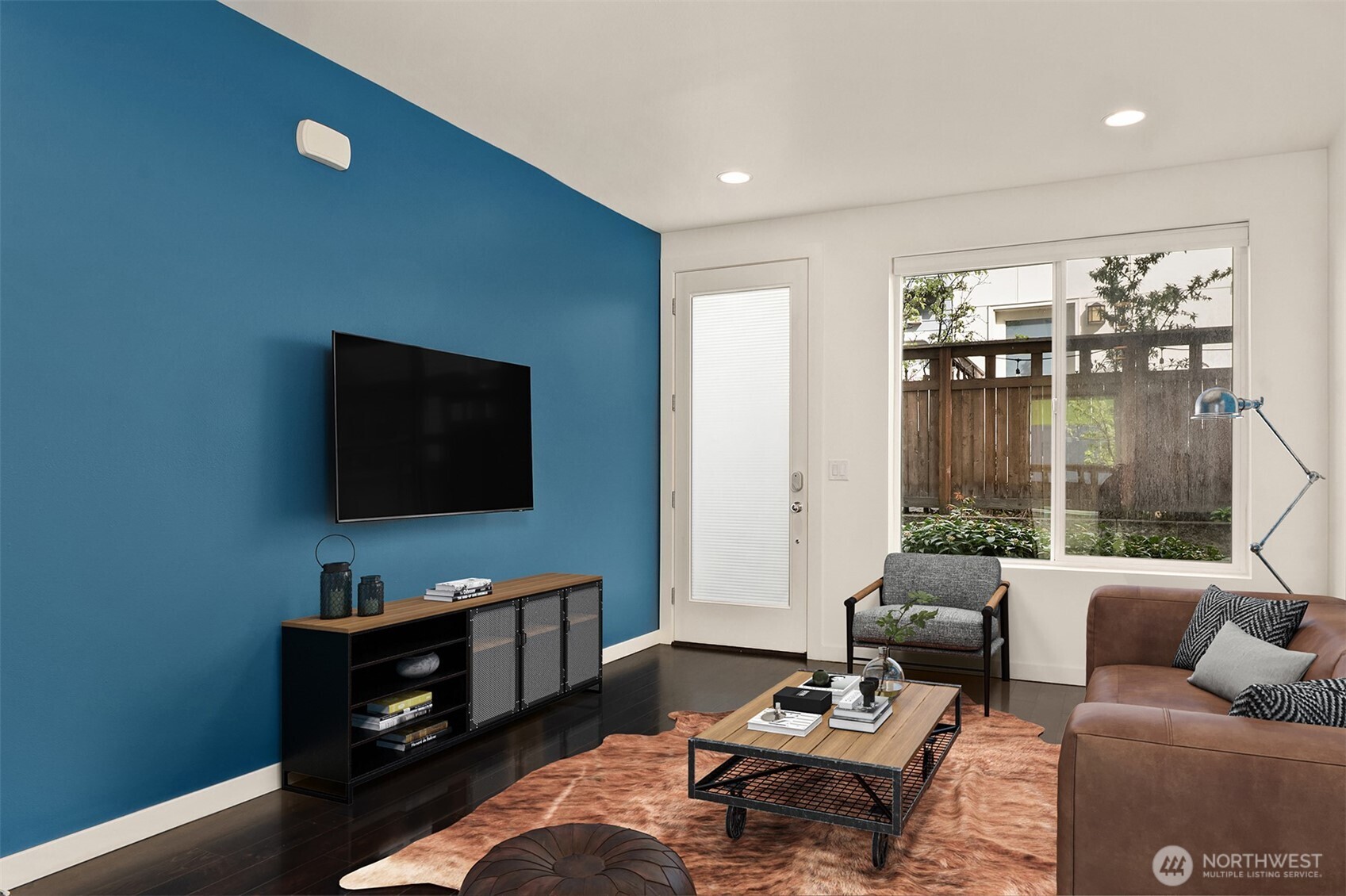 3631 Courtland Place South, Unit B Seattle, WA 98144 - Photo 3 of 27 a living room with furniture and a flat screen tv