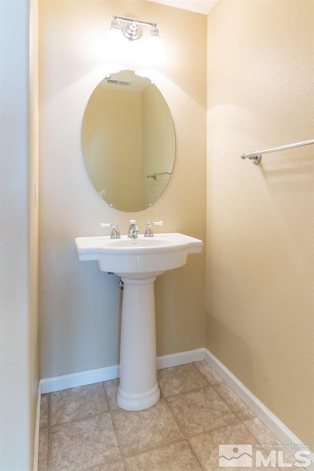 1657 Spicewood Circle Reno, NV 89523 - Photo 6 of 23 a bathroom with a sink