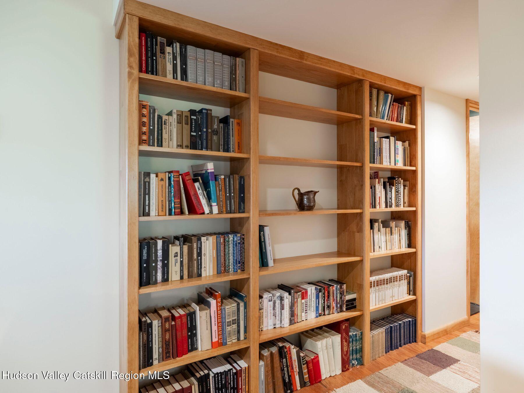 5147 Rte 23c Jewett, NY 12444 - Photo 22 of 54 a living room with furniture and a book shelf