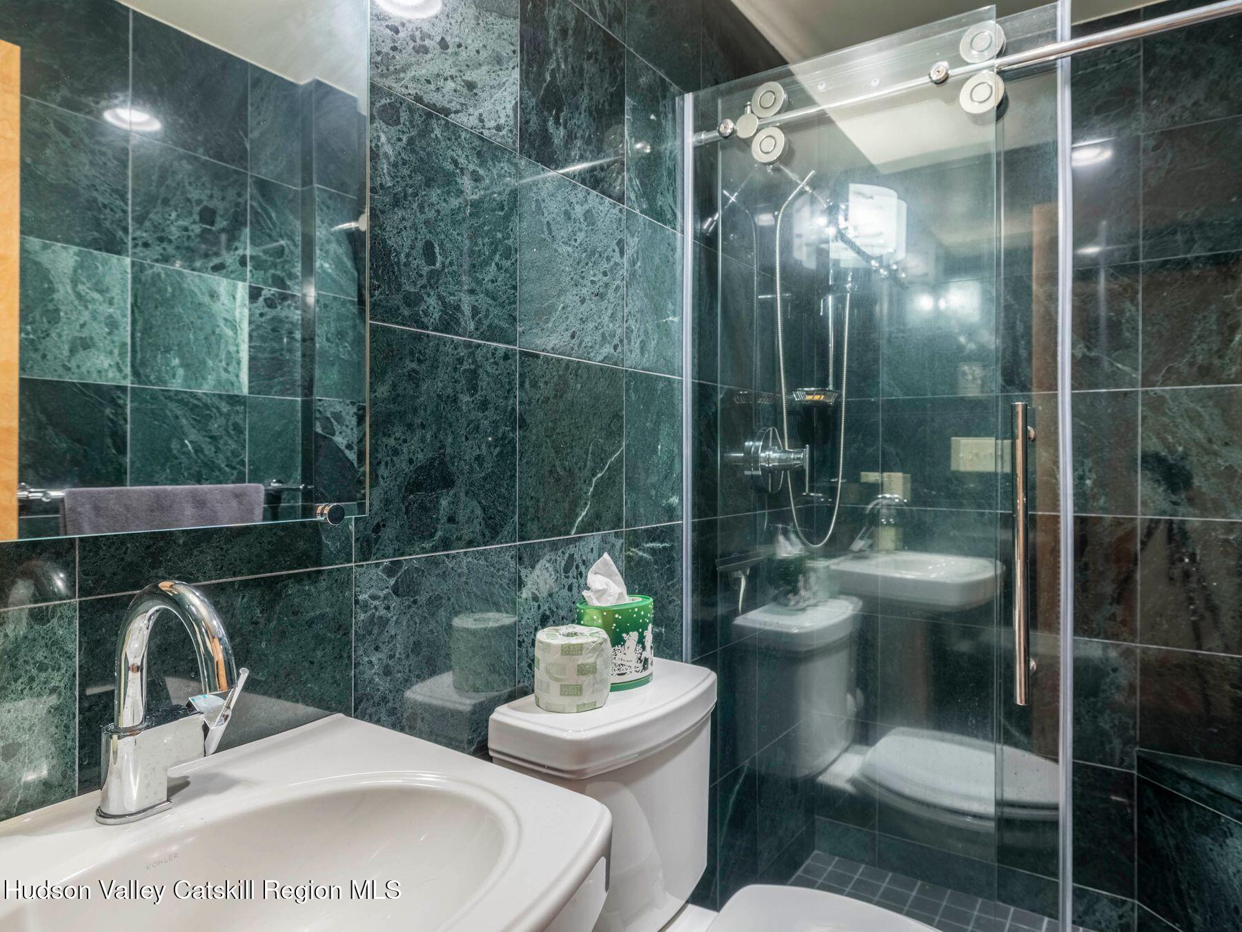 5147 Rte 23c Jewett, NY 12444 - Photo 25 of 54 a bathroom with a sink toilet and shower