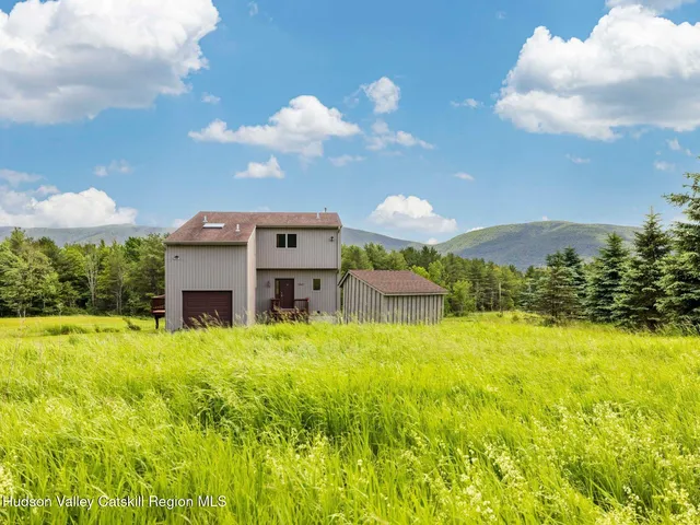 a view of a house with a big yard