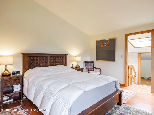 a bathroom with a tub shower and sink