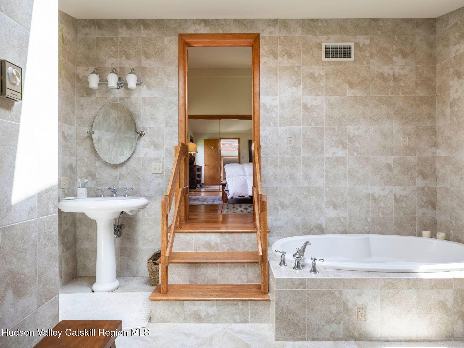 5147 Rte 23c Jewett, NY 12444 - Photo 34 of 54 a bathroom with a tub shower and sink