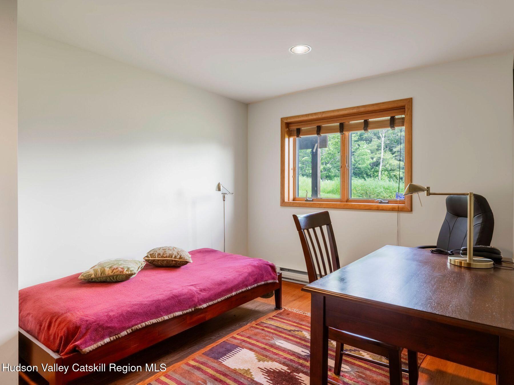 5147 Rte 23c Jewett, NY 12444 - Photo 38 of 54 a bedroom with a bed a desk and chair