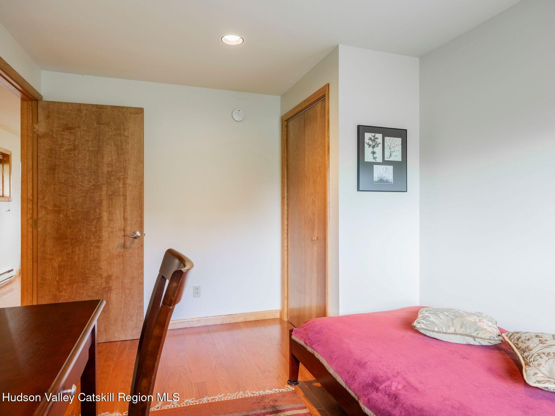 5147 Rte 23c Jewett, NY 12444 - Photo 40 of 54 a bedroom with a bed and a flat screen tv