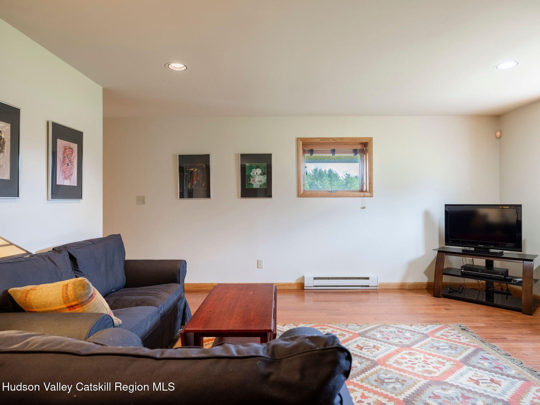 5147 Rte 23c Jewett, NY 12444 - Photo 44 of 54 a living room with furniture and a flat screen tv
