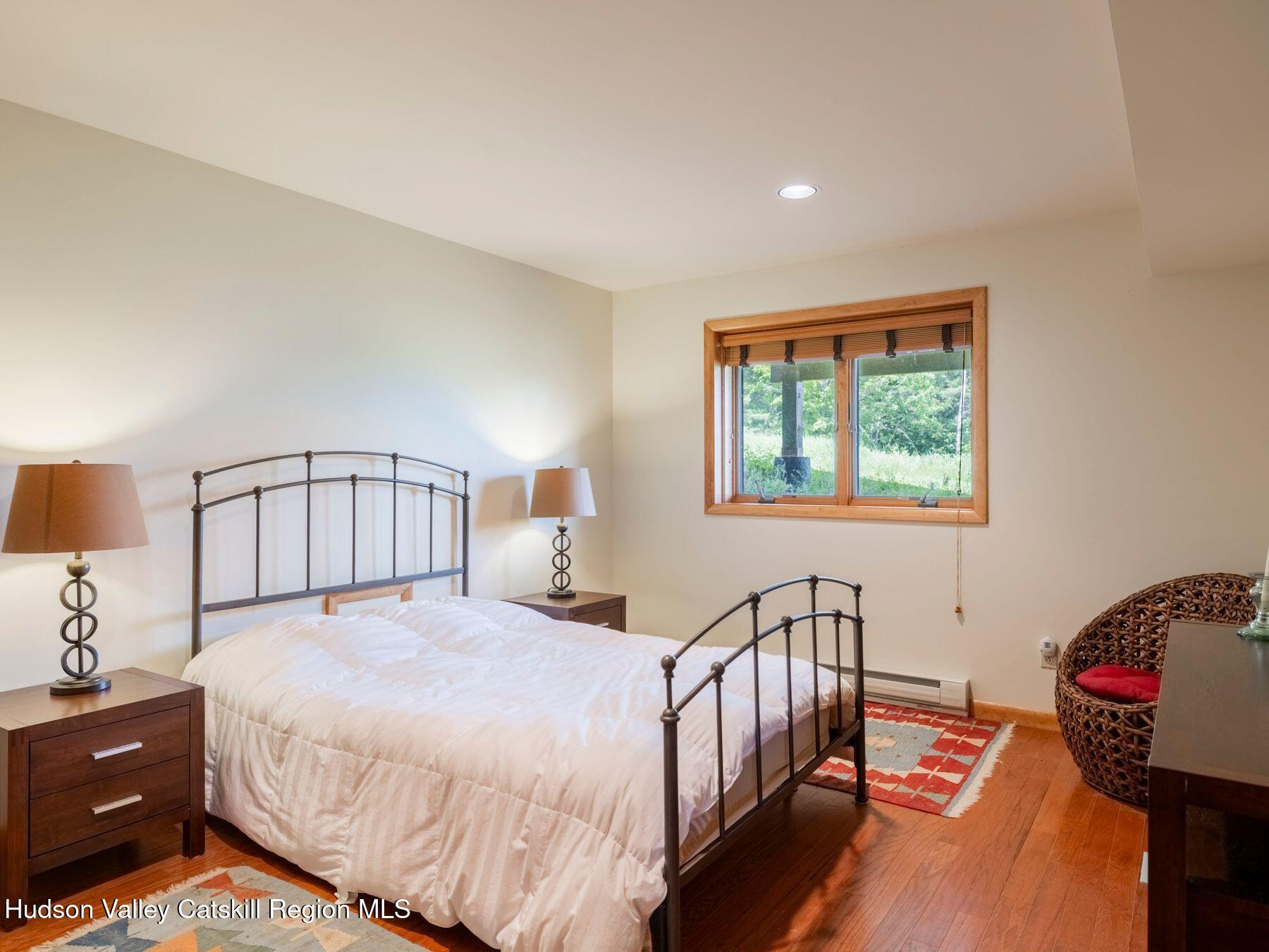 5147 Rte 23c Jewett, NY 12444 - Photo 45 of 54 a bedroom with a bed and a window