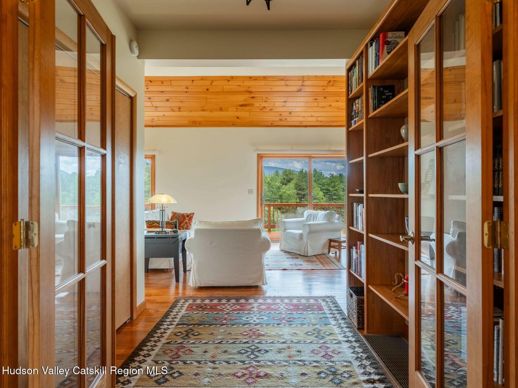 5147 Rte 23c Jewett, NY 12444 - Photo 6 of 54 a living room with a large window and table