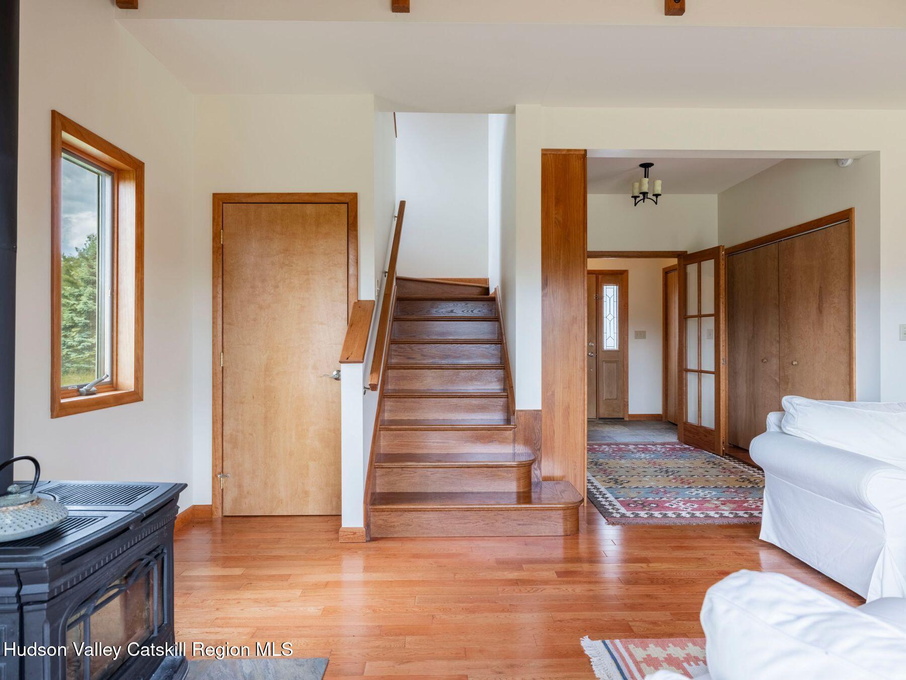 5147 Rte 23c Jewett, NY 12444 - Photo 9 of 54 a view of entryway with wooden floor and stairs