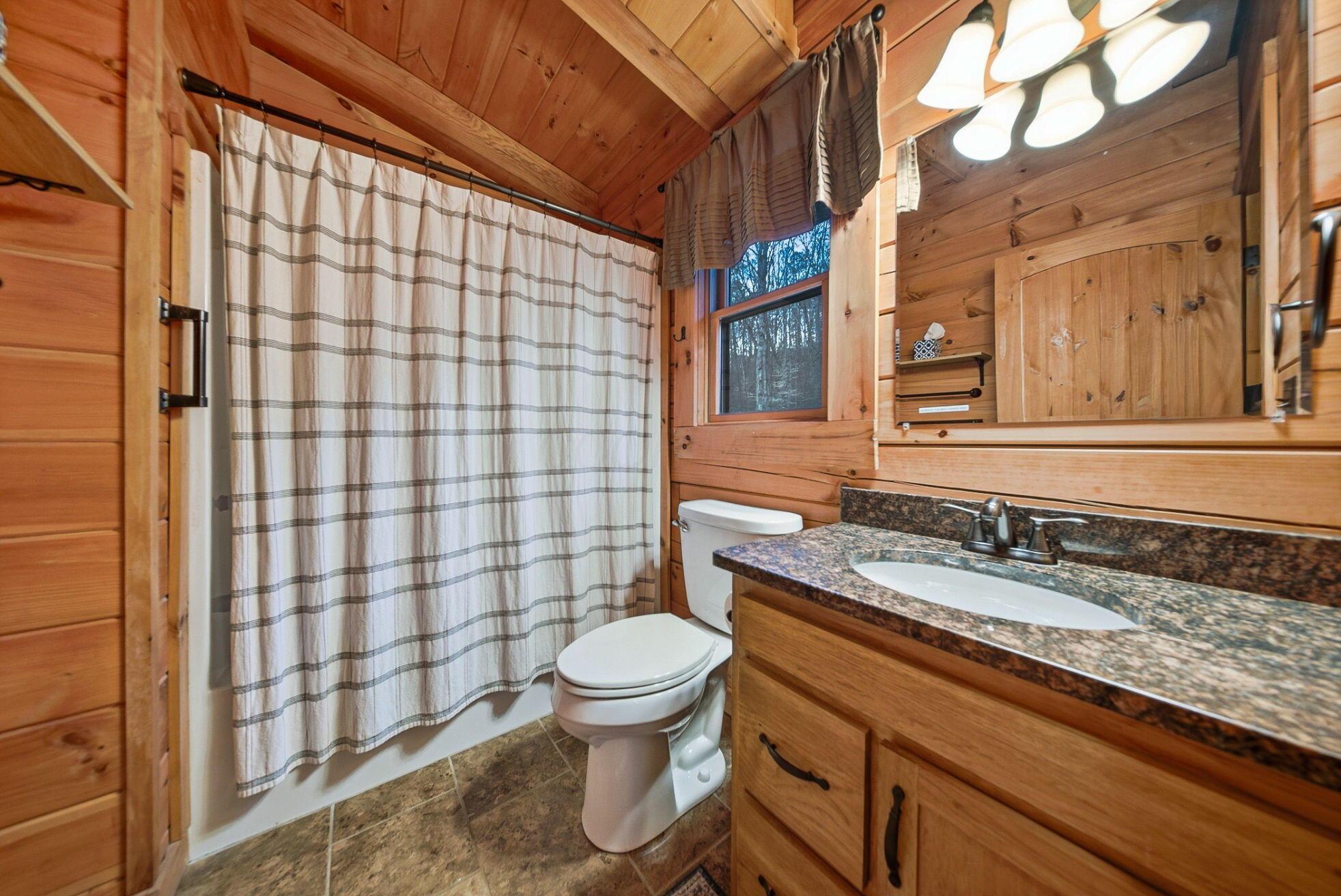 15399 Clapper Hollow Road Laurelville, OH 43135 - Photo 32 of 61 Upper Level Full Bathroom adjacent to Loft with Granite Countertop Vanity and Shower with Tub