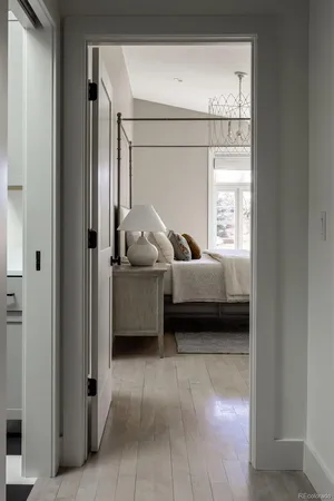a bedroom with a bed window and walk in closet