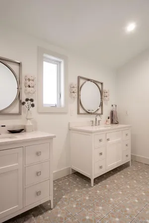a bedroom with a bed and a mirror